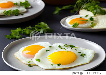 Fried eggs close up on a white plate with herbs on table. Traditional delicious breakfast. AI generated 111499670