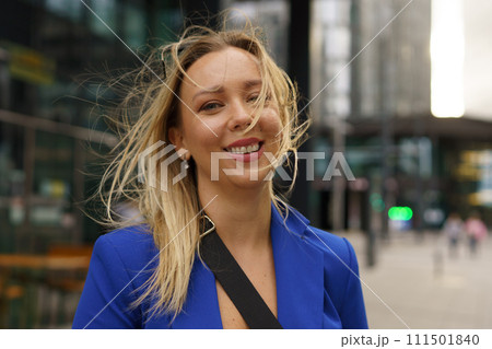 Portrait of beutiful businesswoman standing in front of office building in the city. Portrait of beutiful businesswoman standing in front of office building in the city. 111501840