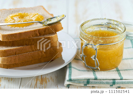 lemon jam sandwiches or toast on white wooden background. lemon jam sandwiches or toast on white wooden background. 111502541