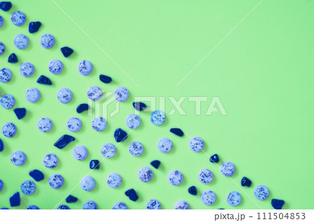 Blue azure stones pebble gems pattern.Green space for advertising text 111504853