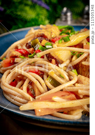 Fried noodles with chicken and vegetables. Fried noodles with chicken and vegetables. 111505348
