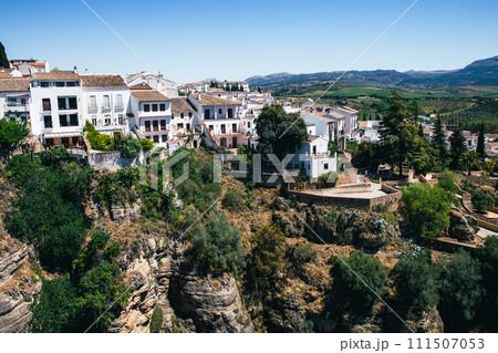 Ronda, Spain. Aerial evening view of New Bridge over Guadalevin River in Ronda, Andalusia, Spain. View of the touristic city. Ronda, Spain. Aerial evening view of New Bridge over Guadalevin River in Ronda, Andalusia, Spain. View of the touristic city. 111507053
