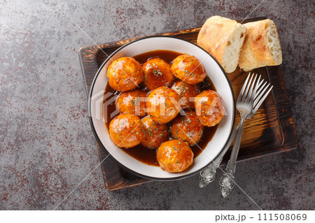 Chicken Meatballs with Chipotle Honey Sauce closeup on the bowl. Horizontal top view 111508069