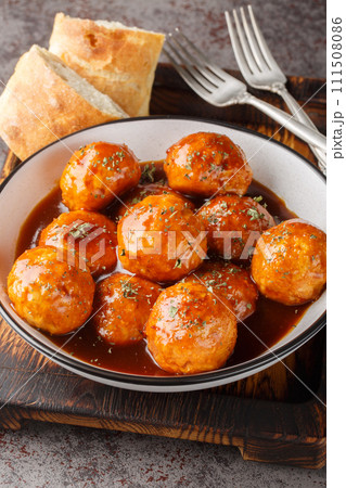 Chipotle Honey Meatballs are the perfect sweet and spicy Mexican appetizer closeup on the bowl. Vertical 111508086