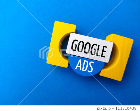 Top view colored block with text GOOGLE ADS on a blue background. 111510439
