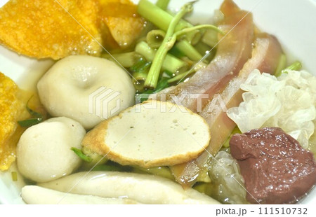 boiled fish ball and line with morning glory vegetable in soup on bowl  111510732