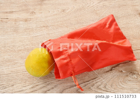 close up of tangerine orange in red bag for gift on Chinese new year festival 111510733