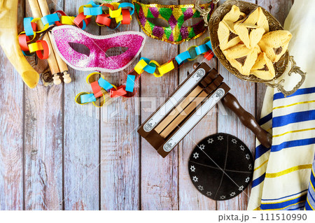 Major Jewish holiday of remembrance, Purim is associated with carnival mask hamantaschen cookies as symbols of celebration. 111510990