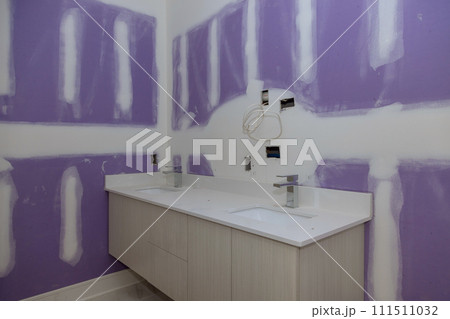 Installation of wash basins cabinet with drawers, white porcelain sink stainless steel faucet at bathroom Installation of wash basins cabinet with drawers, white porcelain sink stainless steel faucet at bathroom 111511032