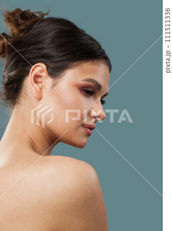 Good-looking cheerful woman brunette with natural make-up, healthy clean fresh skin and wavy hair Good-looking cheerful woman brunette with natural make-up, healthy clean fresh skin and wavy hair 111511336