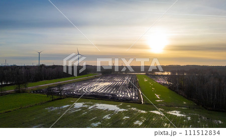 Aerial View of Sunset Over Agricultural Plastic Coverings Aerial View of Sunset Over Agricultural Plastic Coverings 111512834