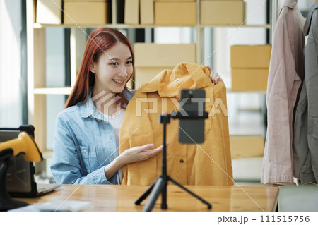 Entrepreneur Showcasing Clothes for Online Store 111515756