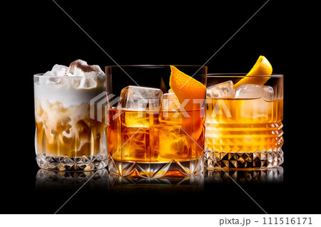 Set of Negroni in a crystal-cut rocks glass isolated on black backdrop 111516171