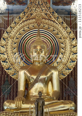 Golden buddha statue sitting in sanctuary at temple in Bangkok, Thailand. 111516213
