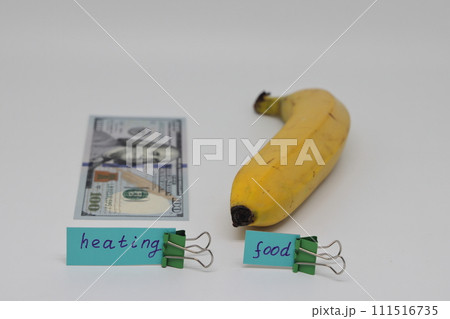 Dollar bills inserted into the radiator slots of  heating system, the increase in the cost of heat 111516735