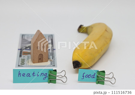 Dollar bills inserted into the radiator slots of  heating system, the increase in the cost of heat 111516736