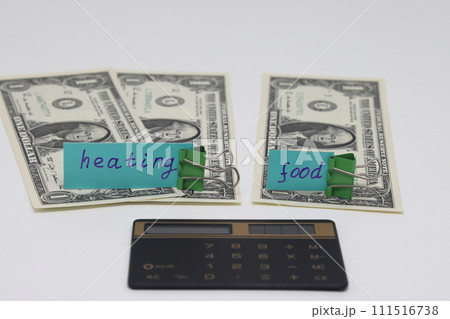 Dollar bills inserted into the radiator slots of  heating system, the increase in the cost of heat 111516738