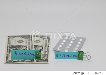 Dollar bills inserted into the radiator slots of  heating system, the increase in the cost of heat 111516742