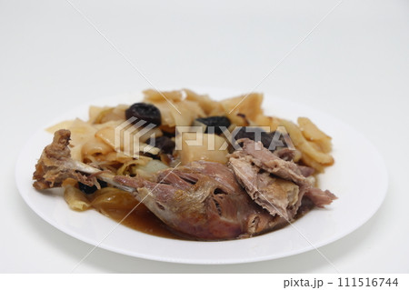 Warm salad with duck and baked apple on white background. Warm salad with duck and baked apple on white background. 111516744