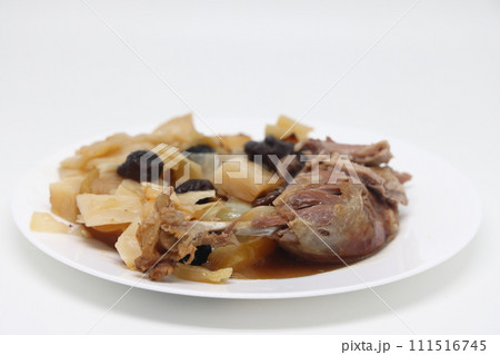 Warm salad with duck and baked apple on white background. Warm salad with duck and baked apple on white background. 111516745
