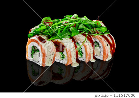 Sushi rolls with cream cheese, hiyashi wakame, salmon served with greens 111517000