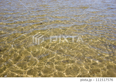 Texture of transparent sea waves in sunlight Texture of transparent sea waves in sunlight 111517576