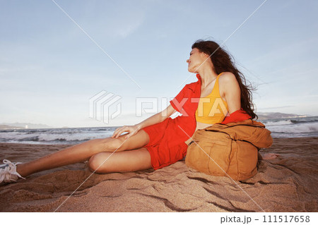 Travel Joy: Backpacking through Nature's Beaches - The Serene Sands of a Free-Spirited Tourist's Relaxing Adventure 111517658