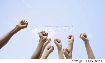 Different fists of people waving in the air 111518041