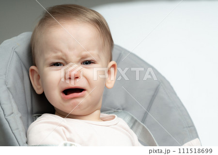 Portrait of crying toddler baby upset of being hungry and tired 111518699