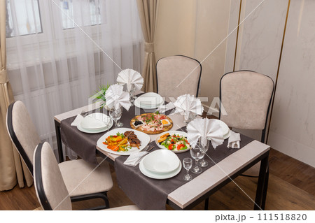 Table set up for four persons in a cafe, cafeteria, restaurant. Table set up for four persons in a cafe, cafeteria, restaurant. 111518820