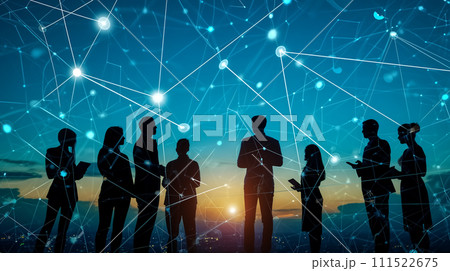 Silhouettes of business professionals interconnected by a digital network against a backdrop of a sunset cityscape, symbolizing teamwork and connectivity. 111522675