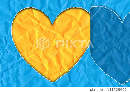 Scrap of paper in the shape of a heart in the colors of the Ukrainian flag 111529661