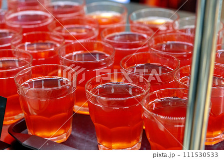Glasses of juice on display on the table in a canteen 111530533