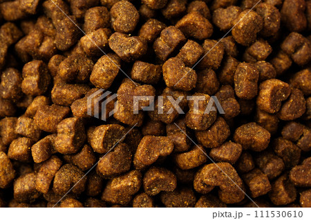 Dry pet food granules for background top view 111530610