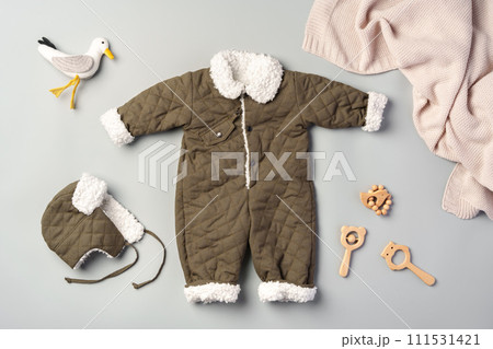 Gray quilted baby overalls for winter flat lay Gray quilted baby overalls for winter flat lay 111531421