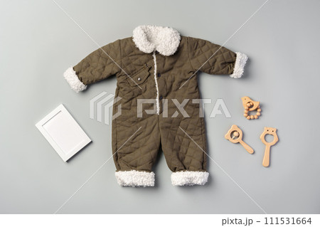 Gray quilted baby overalls for winter flat lay Gray quilted baby overalls for winter flat lay 111531664