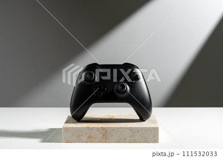 Joystick on sunlight against gray background close up 111532033