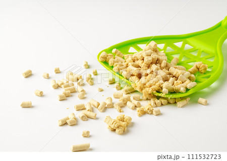 Wooden pet litter filler with scoop isolated on white background 111532723