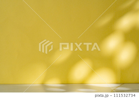 Abstract shadow from the window on yellow background Abstract shadow from the window on yellow background 111532734
