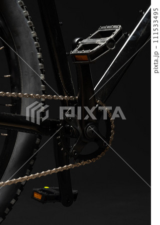 New bicycle chain part close up on black background 111533495