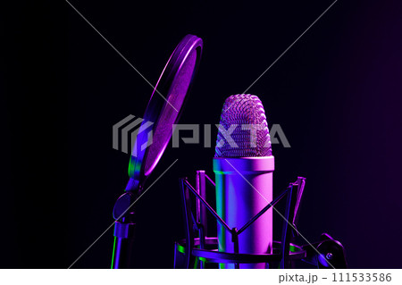 Professional microphone against black background in studio 111533586