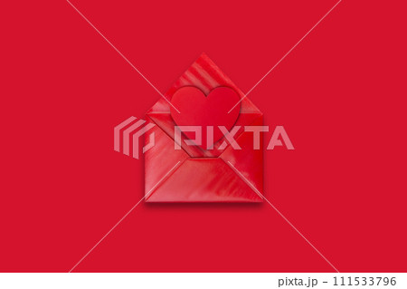 Love letter. red envelope with red valentine heart on red background, top view 111533796