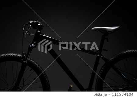 Black mountain bicycle on black background 111534104