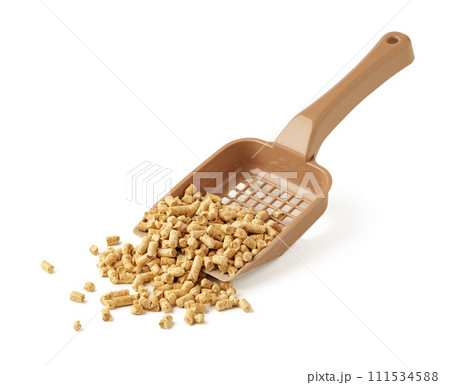 Wooden pet litter filler with scoop isolated on white background Wooden pet litter filler with scoop isolated on white background 111534588