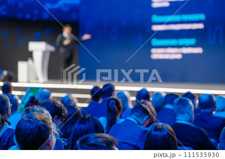 Business conference presentation with speaker and attentive audience Business conference presentation with speaker and attentive audience 111535930