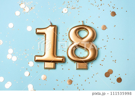 Gold candles in the form of number eighteen. Gold candles in the form of number eighteen. 111535998