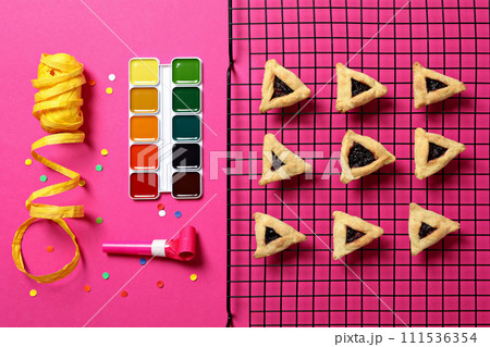 Purim holiday concept, with traditional symbols and decor. 111536354