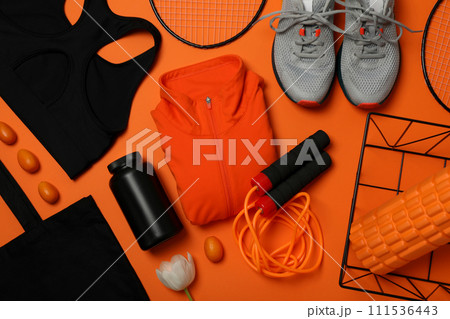 Sportswear with flowers on an orange background. 111536443