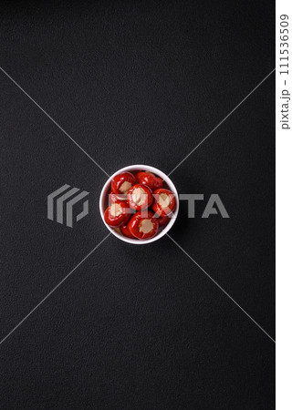 Red bell peppers stuffed with cheese or meat with salt, spices and herbs Red bell peppers stuffed with cheese or meat with salt, spices and herbs 111536509