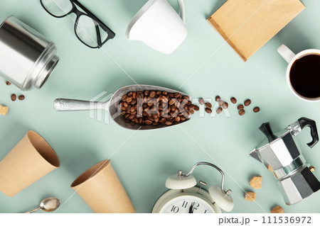 Coffee Break Essentials on Pastel Mint Background Coffee Break Essentials on Pastel Mint Background 111536972